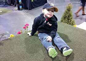 image of kid at kansas city golf show